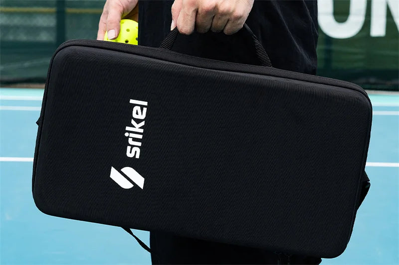 A Comprehensive Guide of How to Improve Your Pickleball Game blog cover: A person holding a black Srikel-branded case with pickleball paddles insdie on a pickleball court.