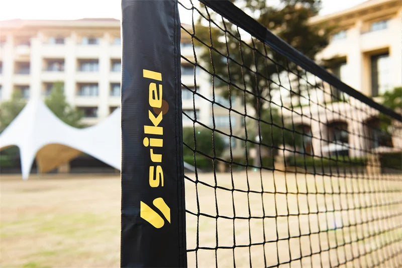 Where to Play Pickleball Near Me in New York City blog cover: shows the detail of a brand pickleball net stand on the grass court